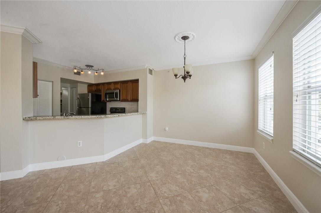 6348 West Sample Road, Unit 6348 Coral Springs, FL 33067 - Photo 6 of 25 Spacious dining area with imact windows