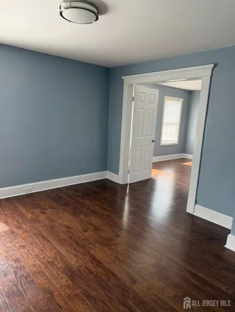 a view of a livingroom with wooden floor