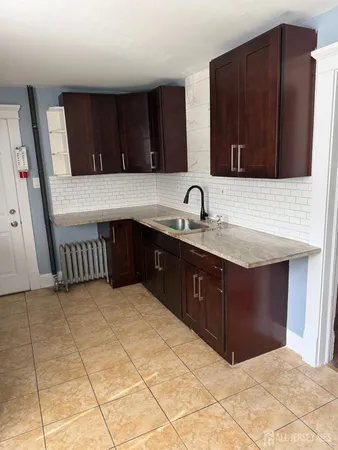 a kitchen with a sink and cabinets