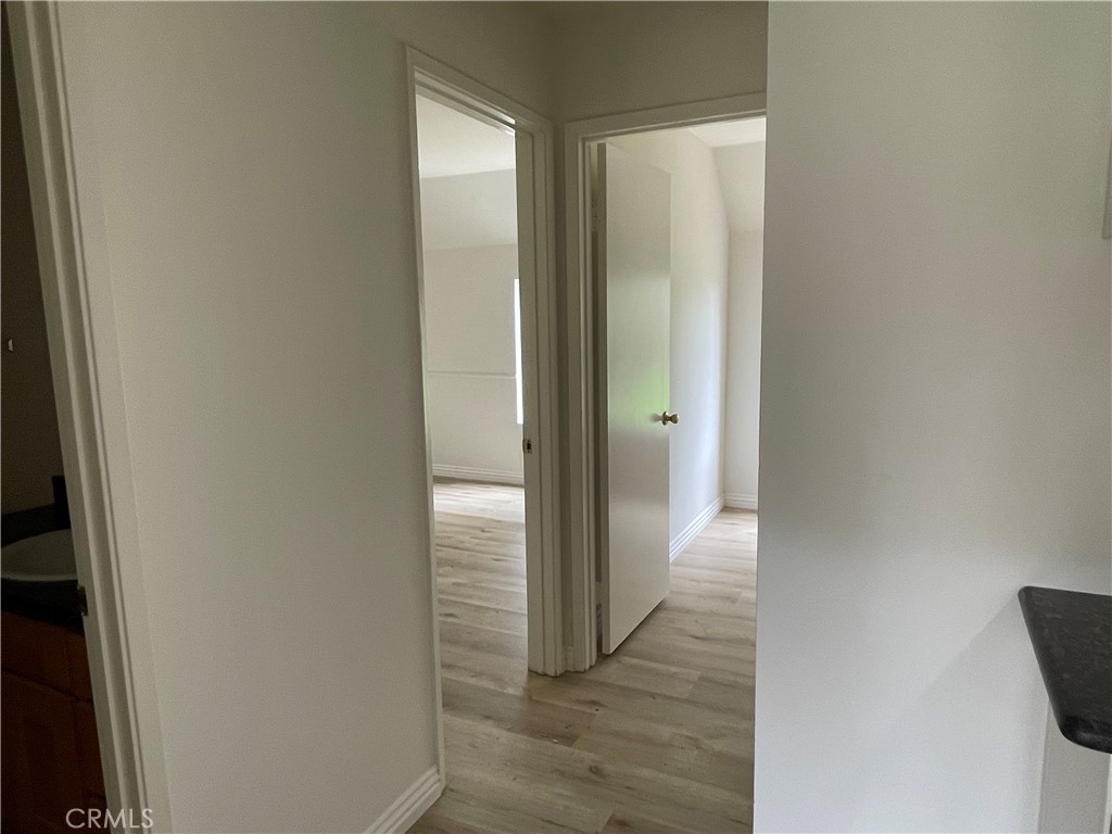 16 Gatewood Irvine, CA 92604 - Photo 9 of 12 a view of a hallway with wooden floor
