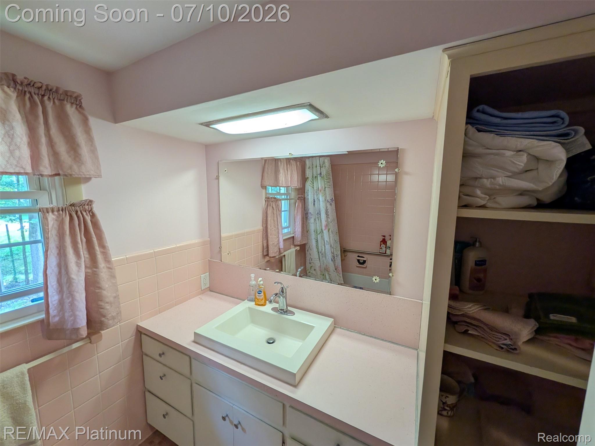 1430 Dauner Road Fenton, MI 48430 - Photo 20 of 41 Full Bathroom 2 with vanity featuring a rectangular drop-in sink, chrome faucet. Lots of storage!