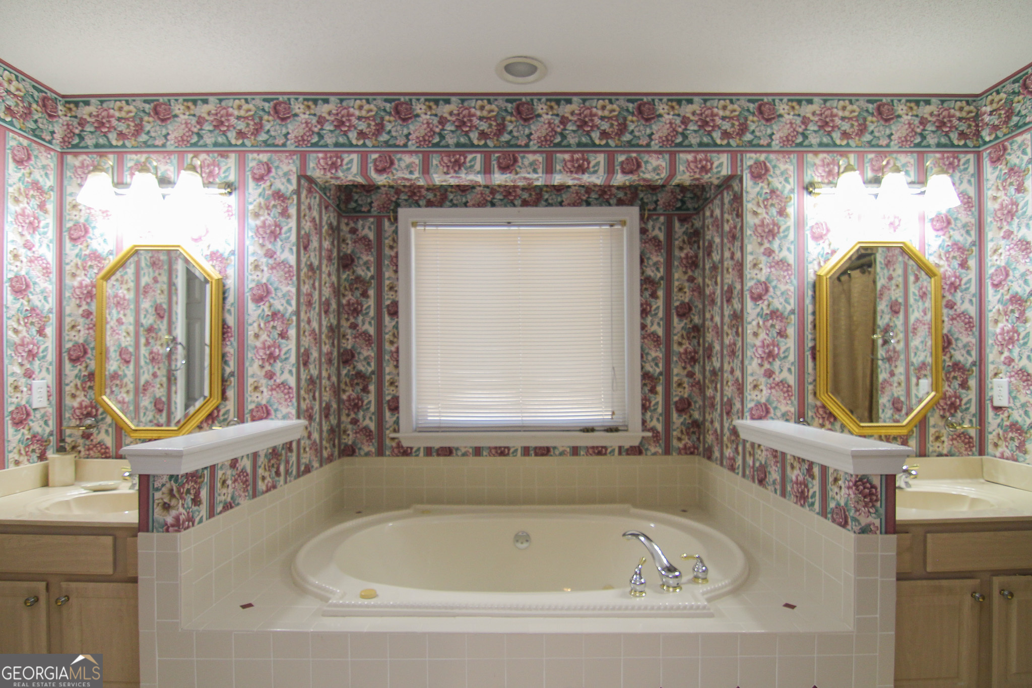 111 Maple Glen Centerville, GA 31028 - Photo 17 of 35 a bathroom with a bathtub sink and mirror