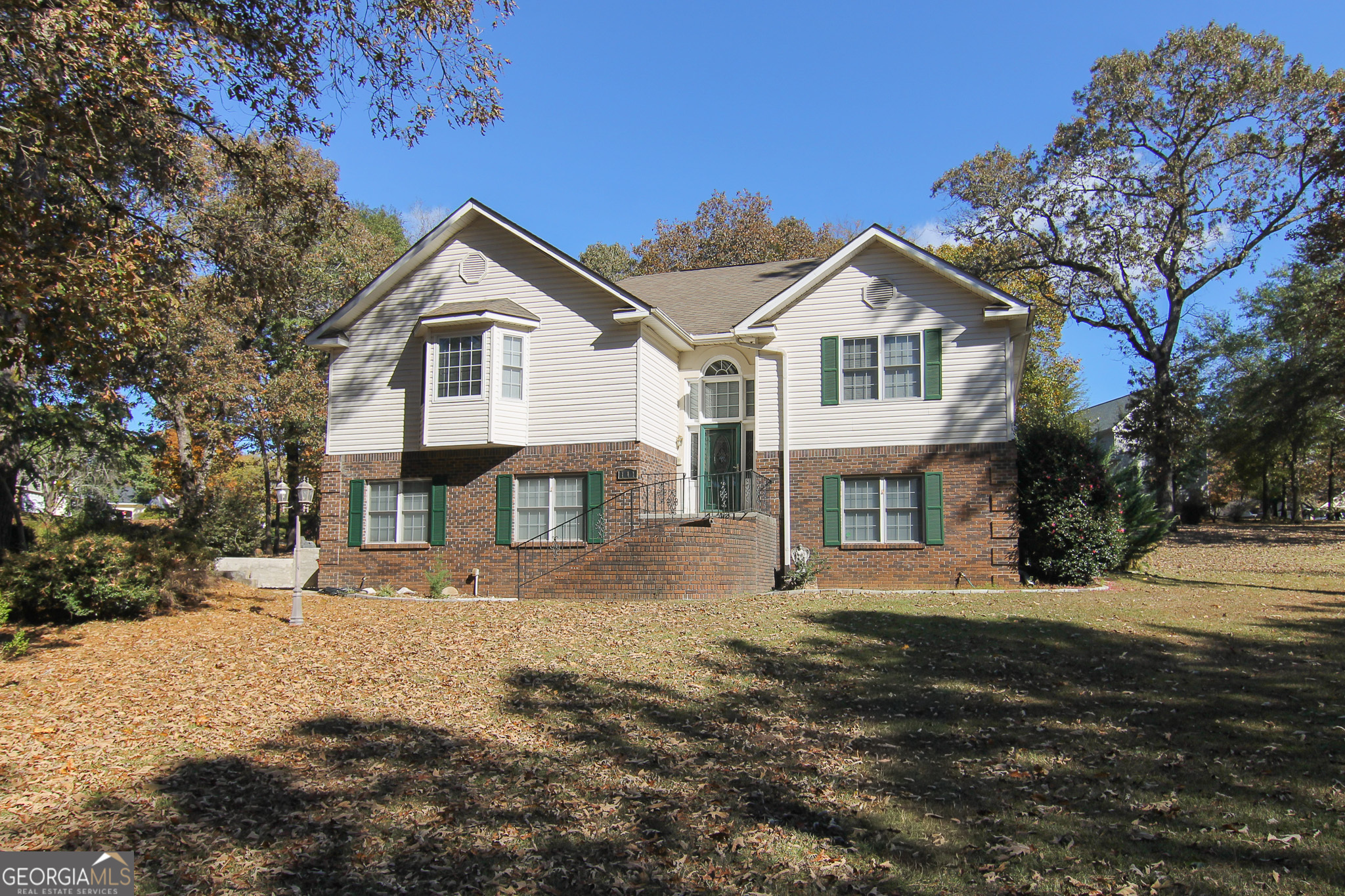 111 Maple Glen Centerville, GA 31028 - Photo 2 of 35 a front view of a house with a yard covered in snow