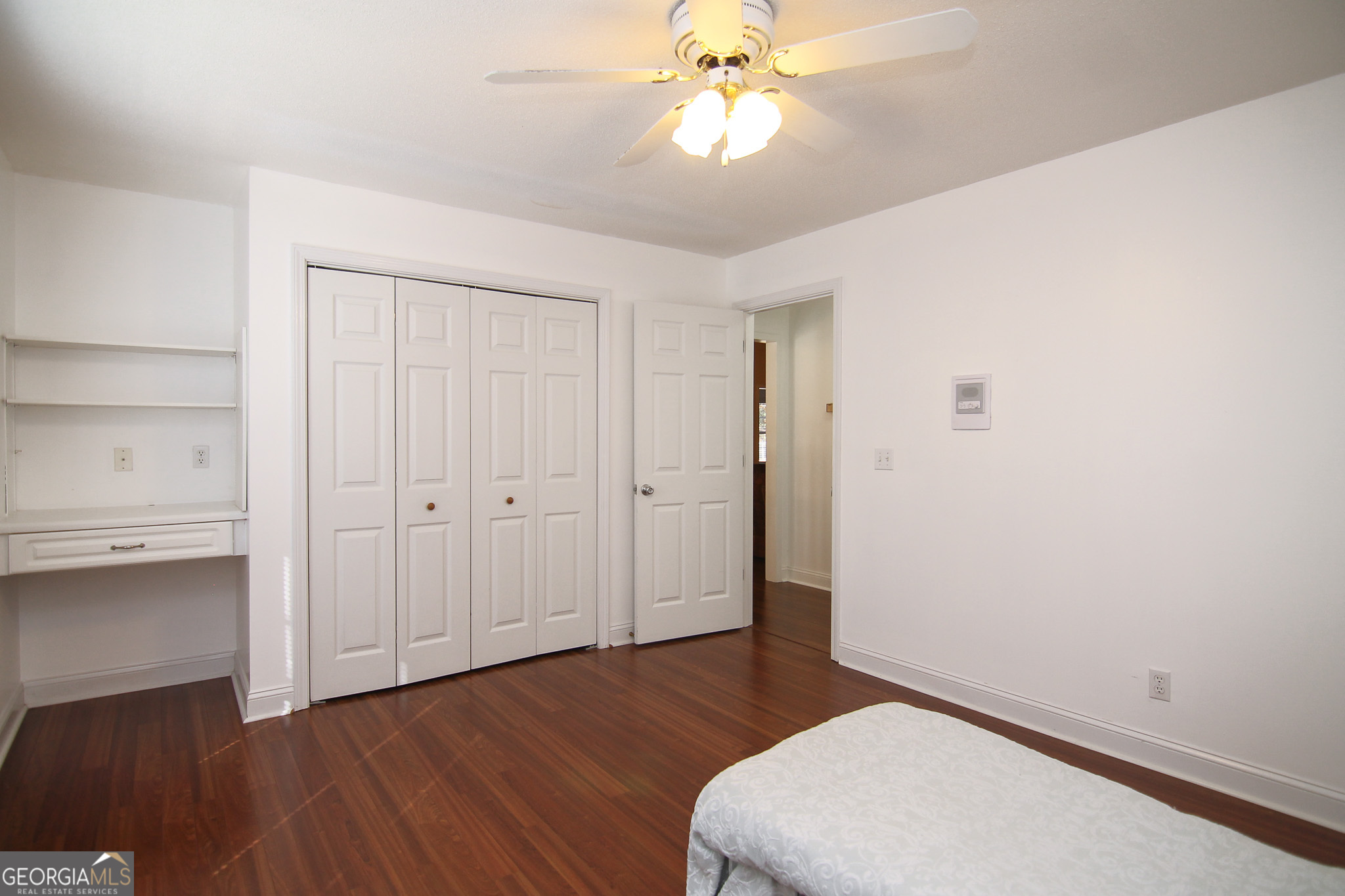 111 Maple Glen Centerville, GA 31028 - Photo 21 of 35 a bedroom with a bed and wooden floor