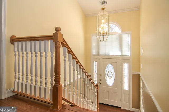 a view of a hallway with windows