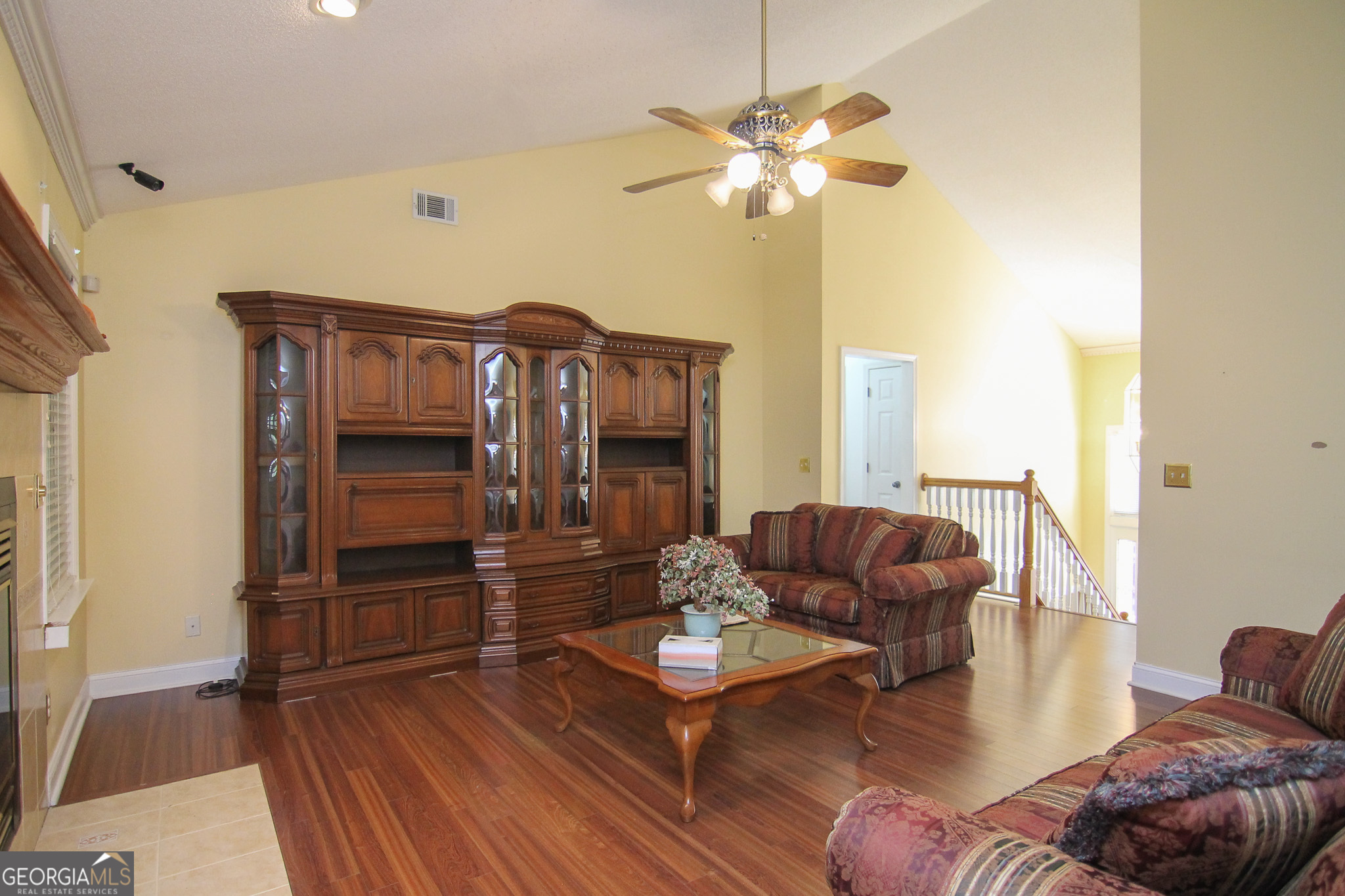 111 Maple Glen Centerville, GA 31028 - Photo 7 of 35 a living room with furniture and a chandelier