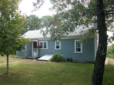 6 Bridge Road Truro, MA 02666 - Photo 1 of 12 a front view of a house with a yard