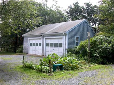 6 Bridge Road Truro, MA 02666 - Photo 5 of 12 a view of a house with a yard and plants