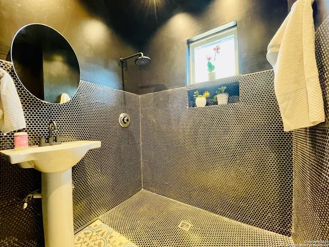 a bathroom with a sink and a mirror