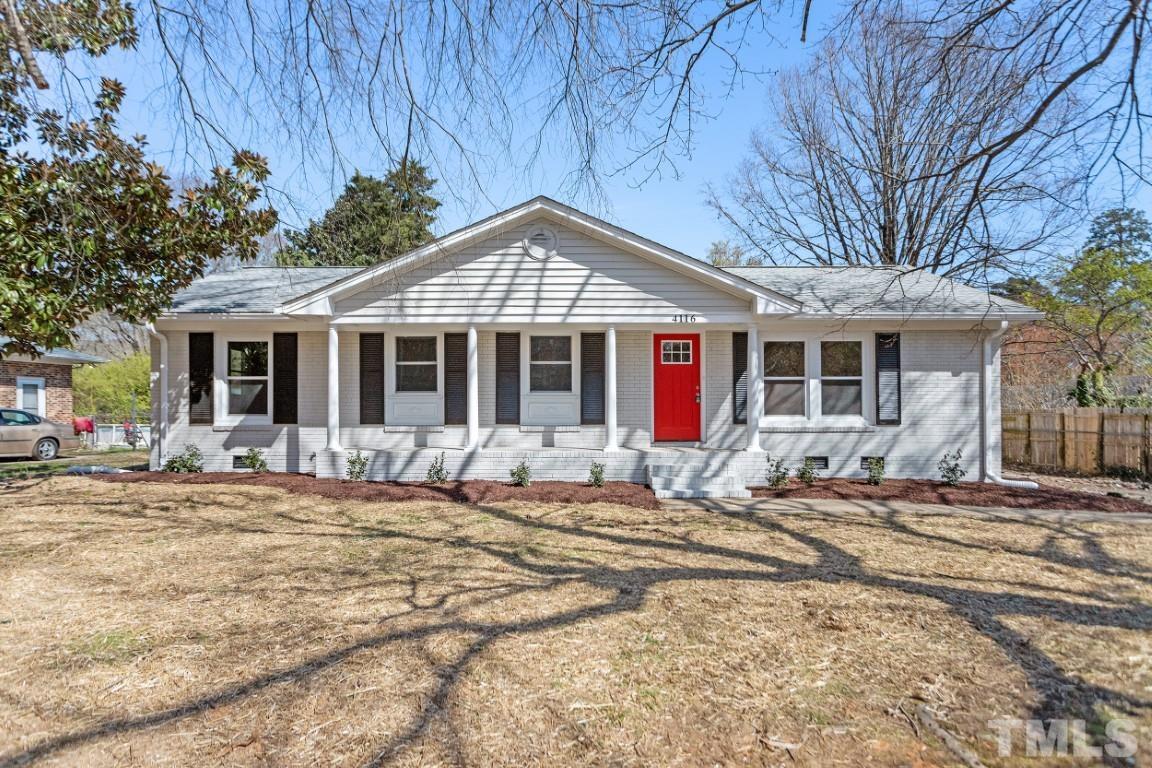 4116 Kilcullen Drive Raleigh, NC 27604 - Photo 1 of 28 a front view of a house with a garden