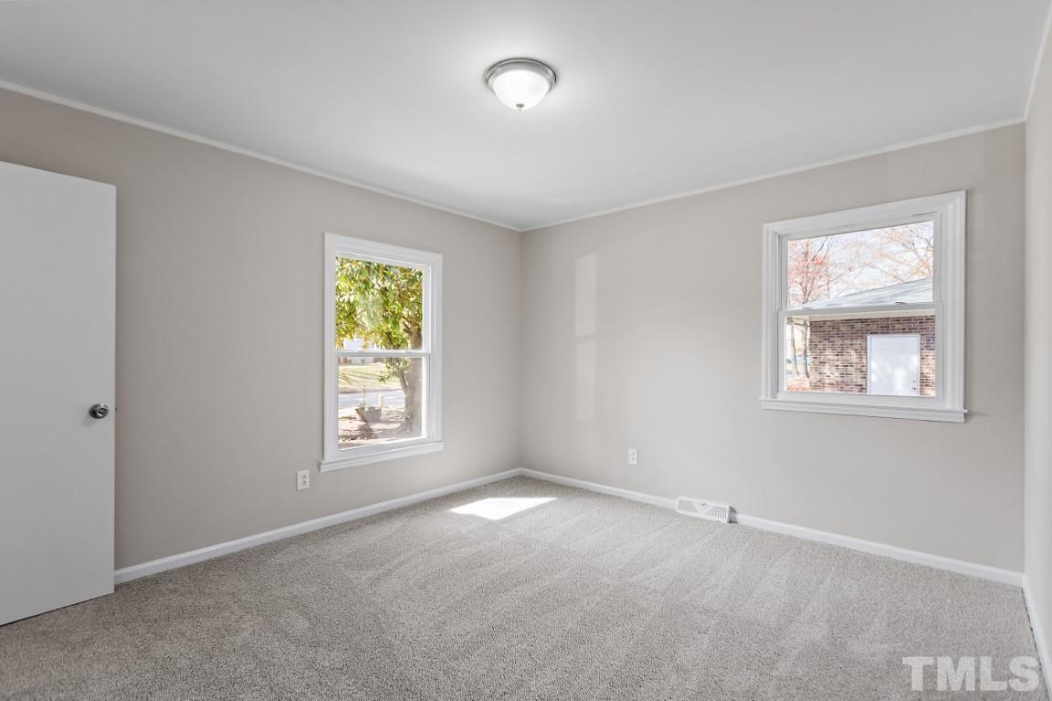 4116 Kilcullen Drive Raleigh, NC 27604 - Photo 11 of 28 a view of an empty room with a window