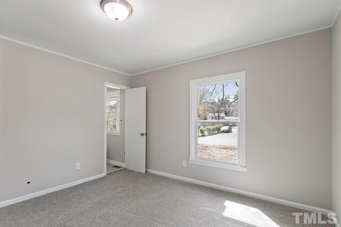 4116 Kilcullen Drive Raleigh, NC 27604 - Photo 12 of 28 a view of an empty room with a window