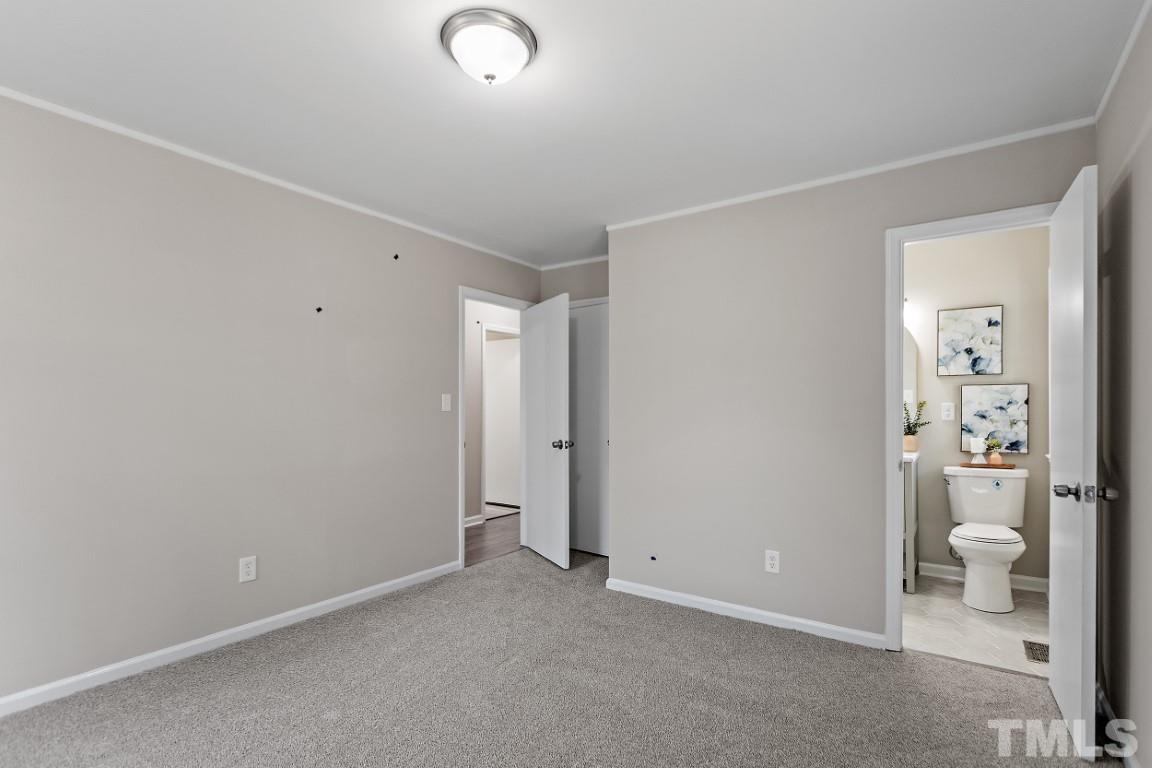 4116 Kilcullen Drive Raleigh, NC 27604 - Photo 13 of 28 an empty room with a bathroom