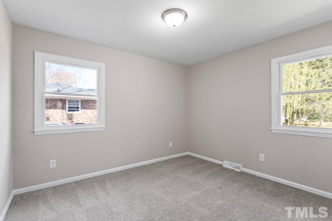 4116 Kilcullen Drive Raleigh, NC 27604 - Photo 16 of 28 an empty room with a window