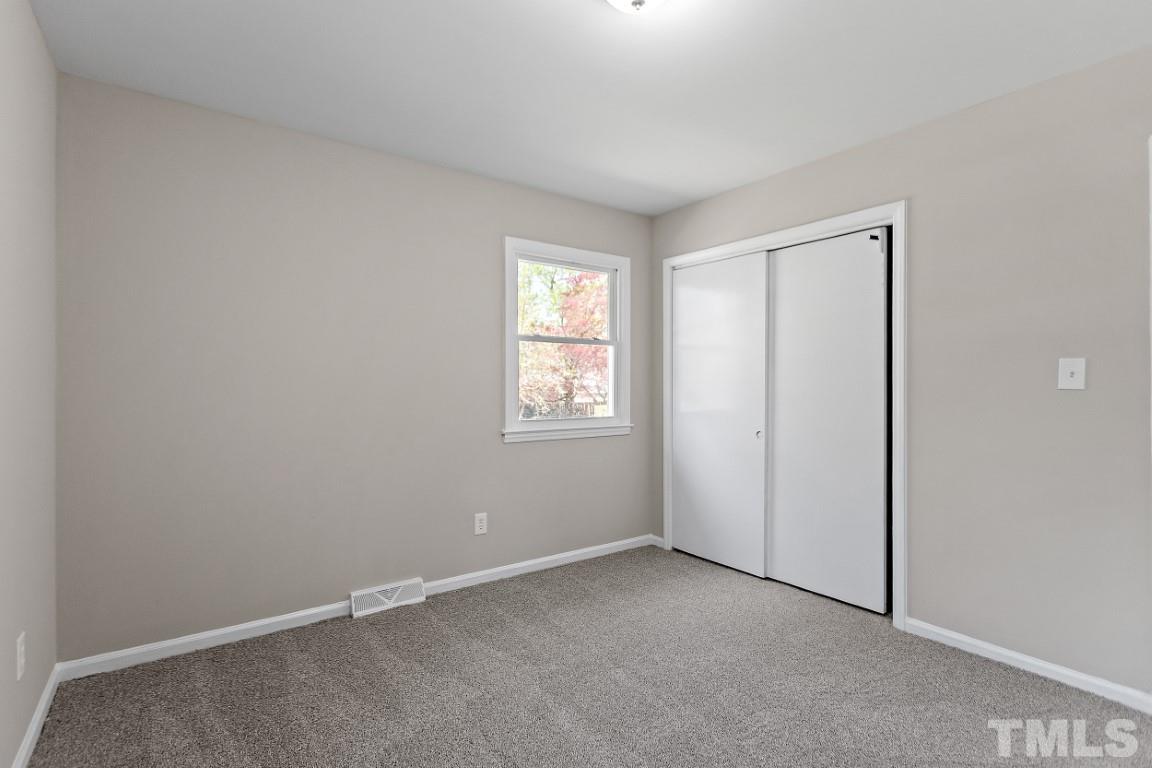4116 Kilcullen Drive Raleigh, NC 27604 - Photo 17 of 28 an empty room with windows