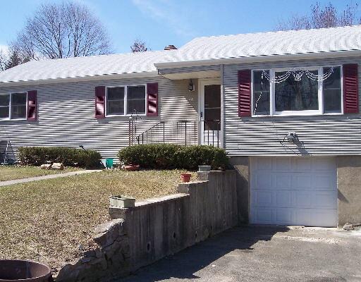 40 Ridgevale Place Bridgeport, CT 06610 - Photo 1 of 1 a front view of a house with a yard