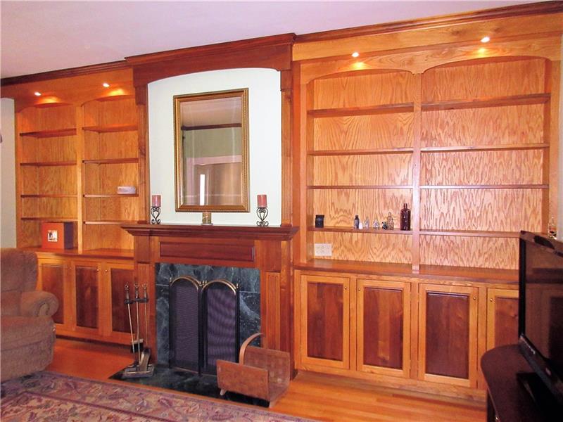 230 Compton Road Sewickley, PA 15143 - Photo 4 of 24 The highlight of the living room is the oak and black walnut fireplace with marble surround and bookcases that were custom built in place and have recessed lighting!