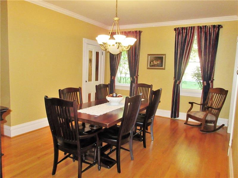 230 Compton Road Sewickley, PA 15143 - Photo 8 of 24 The special features of this dining room include crown moulding, gleaming hardwood floors, the chandelier, and a closet with shelving.