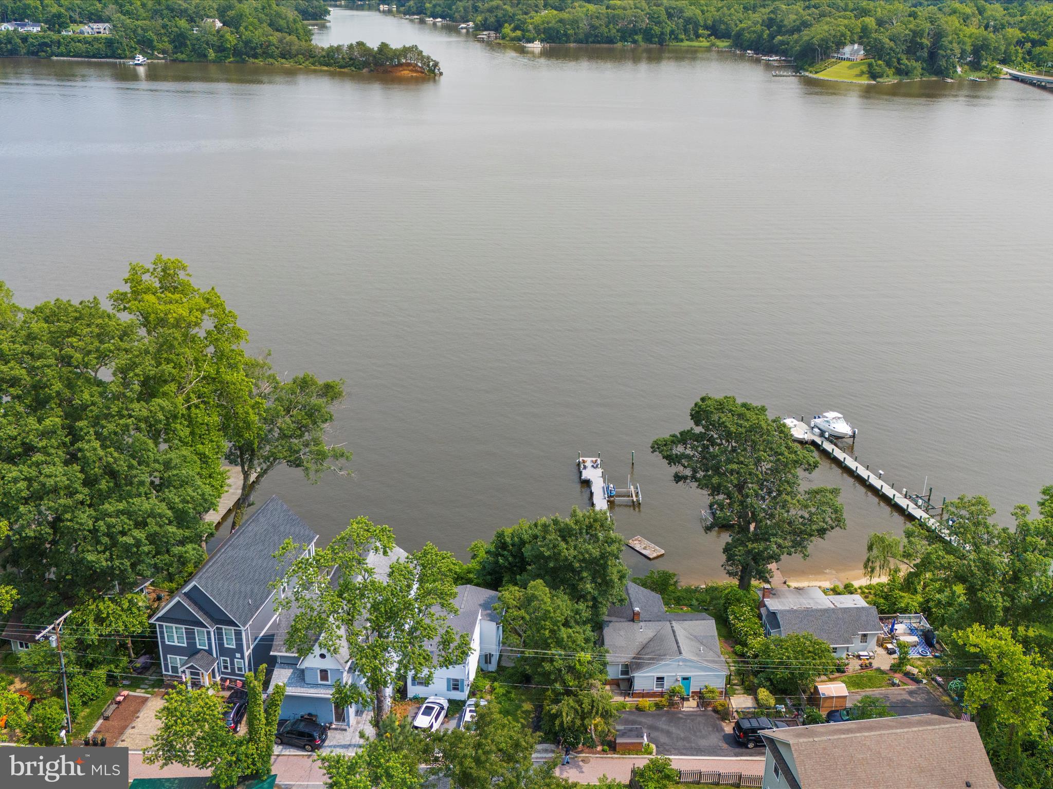 8 Shorewalk Road Riva, MD 21140 - Photo 1 of 20 an aerial view of a house with a lake view