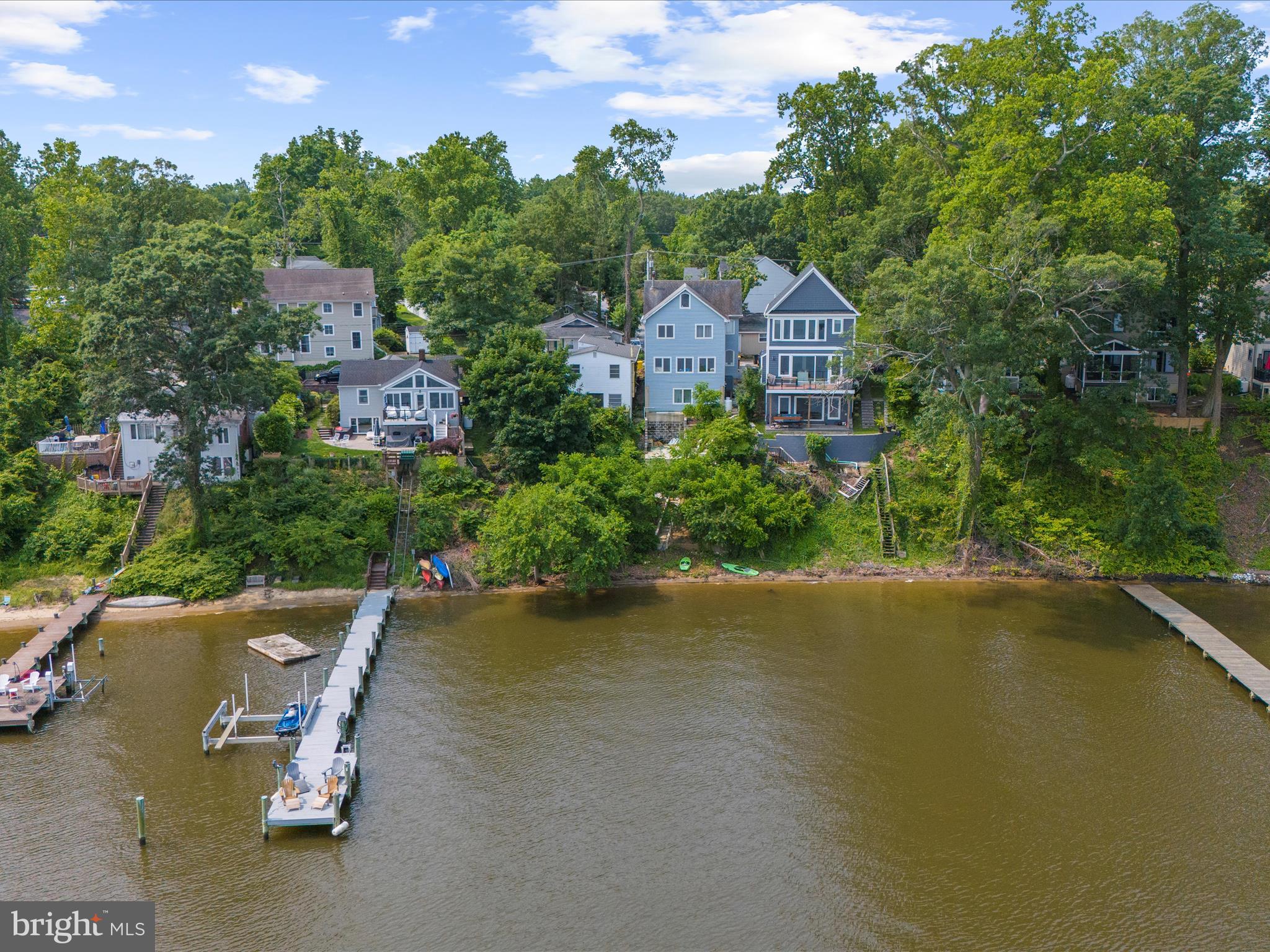 8 Shorewalk Road Riva, MD 21140 - Photo 10 of 20 an aerial view of a house with swimming pool and garden
