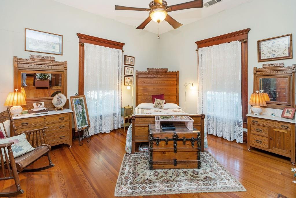 704 East Main Street Honey Grove, TX 75446 - Photo 15 of 38 a living room with furniture and wooden floor