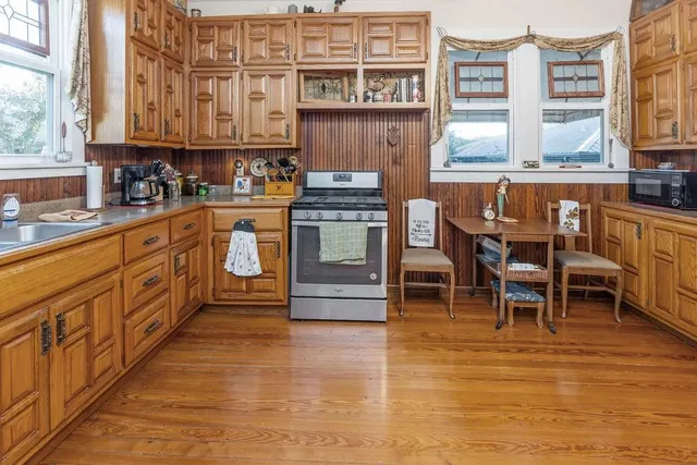 a living room with a large window and couch