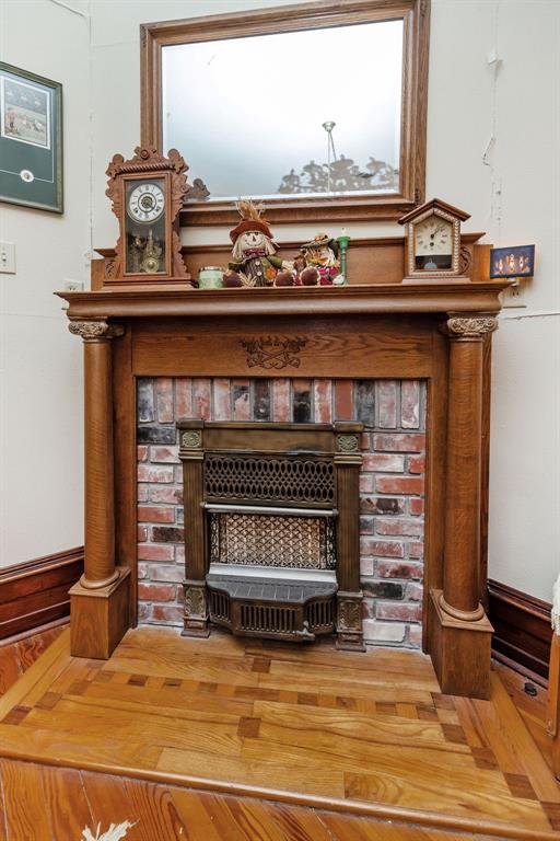 704 East Main Street Honey Grove, TX 75446 - Photo 21 of 38 a view of fireplace in livingroom with mirror
