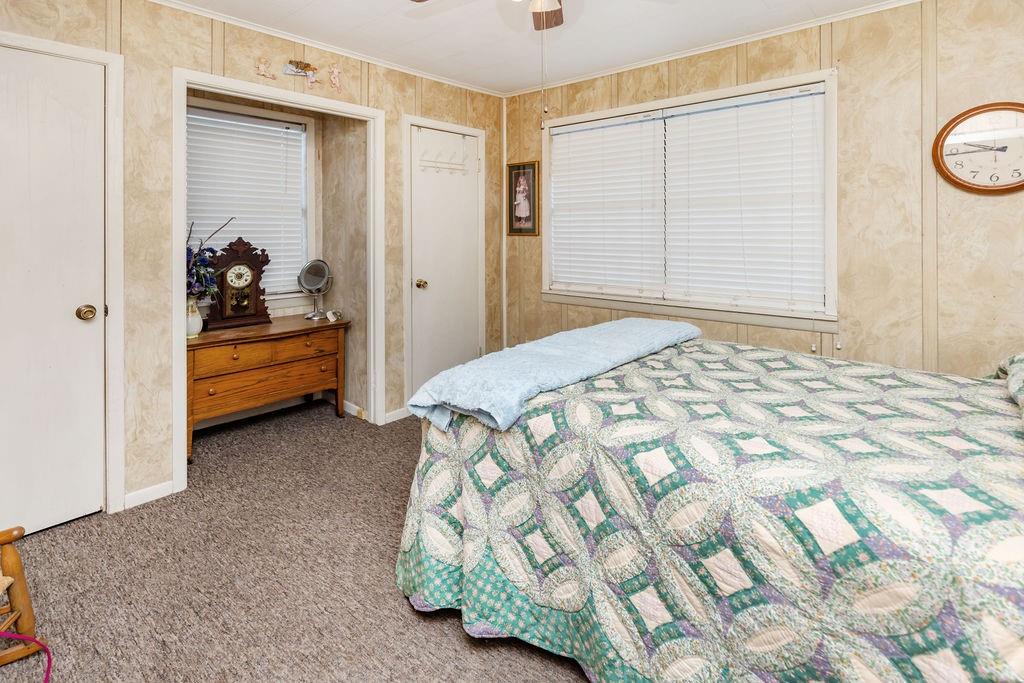 704 East Main Street Honey Grove, TX 75446 - Photo 35 of 38 a bedroom with a bed and a cabinets