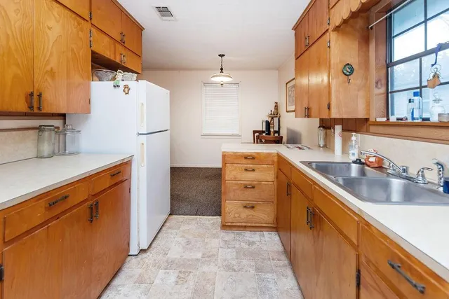 an aerial view of residential houses with city view