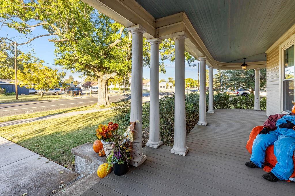 704 East Main Street Honey Grove, TX 75446 - Photo 5 of 38 a view of a room with porch and outdoor seating