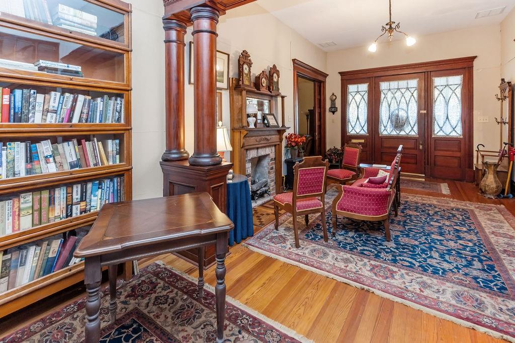 704 East Main Street Honey Grove, TX 75446 - Photo 6 of 38 a living room with furniture a rug and a book shelf
