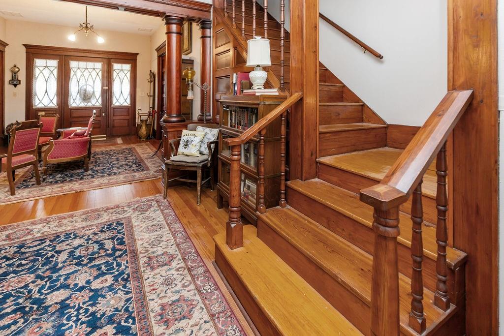 704 East Main Street Honey Grove, TX 75446 - Photo 9 of 38 a view of entryway and hall with wooden floor