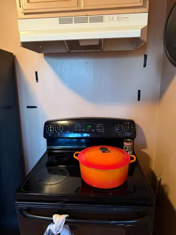 a bathroom with a toilet and a mirror