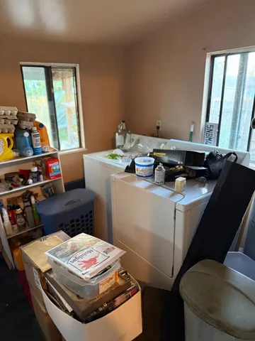 a kitchen with stainless steel appliances granite countertop a sink a stove and a microwave