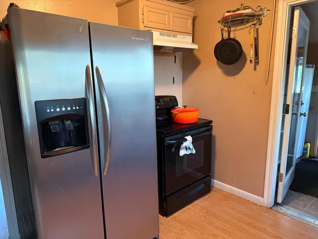 a backyard of a house with lots of green space