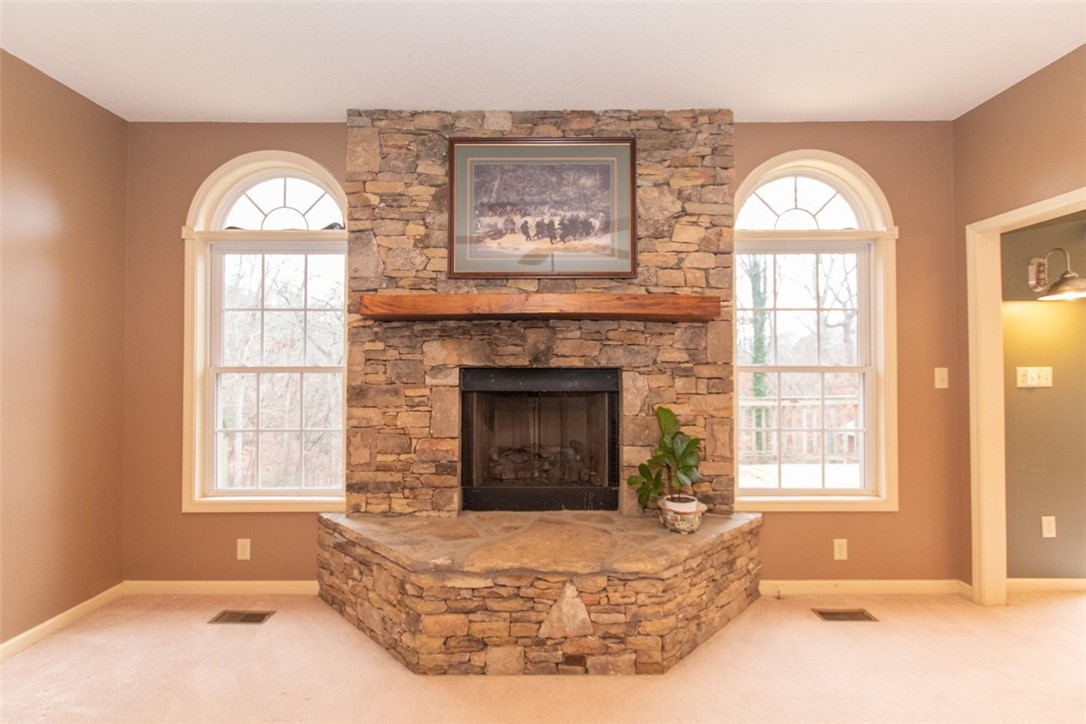 142 Fowler Road Anderson, SC 29625 - Photo 6 of 38 Living room stone fireplace with gas logs.