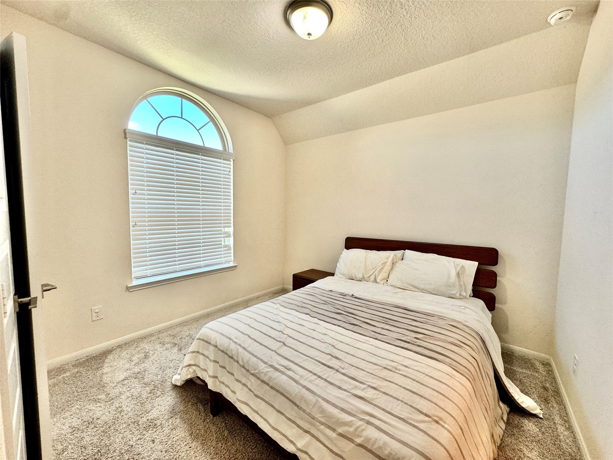 16803 Bark Cabin Drive Humble, TX 77346 - Photo 17 of 27 a bedroom with a bed and a window