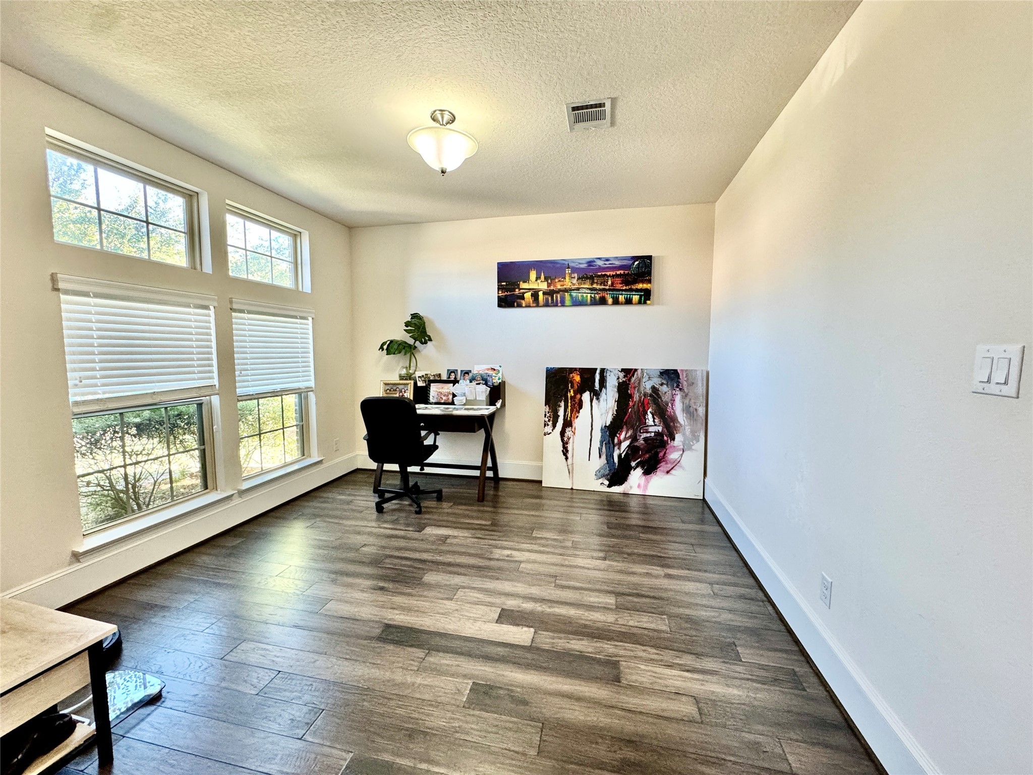 16803 Bark Cabin Drive Humble, TX 77346 - Photo 3 of 27 a view of dining room with wooden floor and a floor to ceiling window