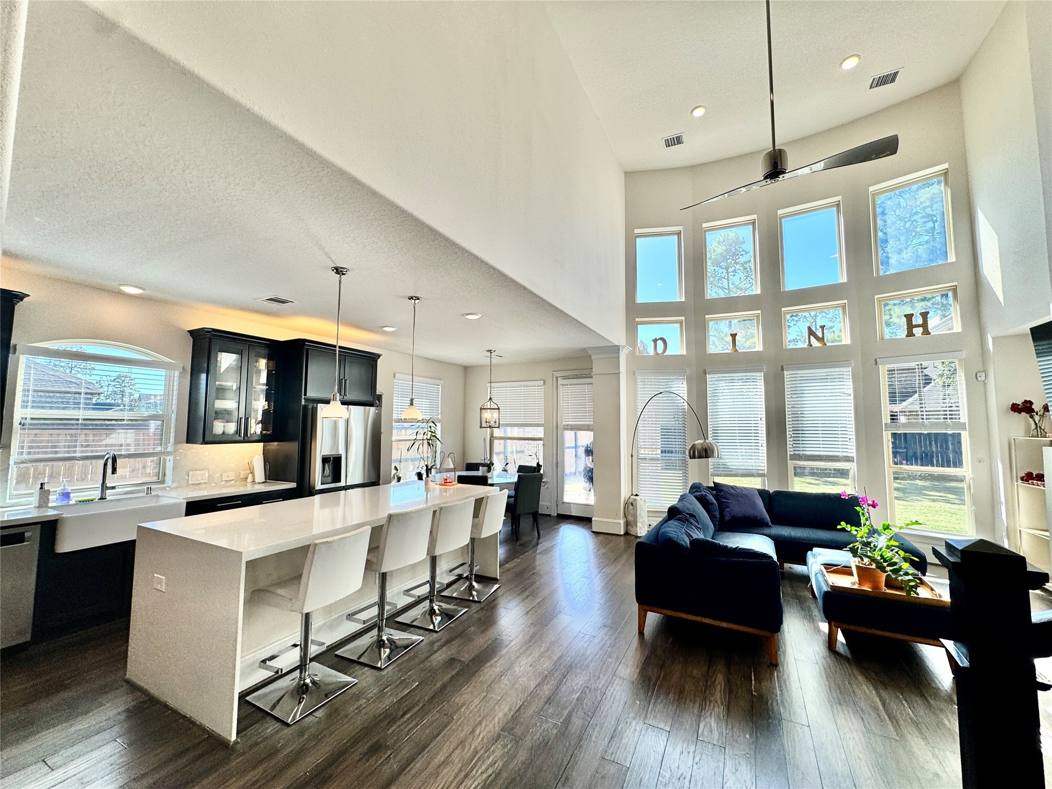 16803 Bark Cabin Drive Humble, TX 77346 - Photo 4 of 27 a living room with furniture dining table and a large window