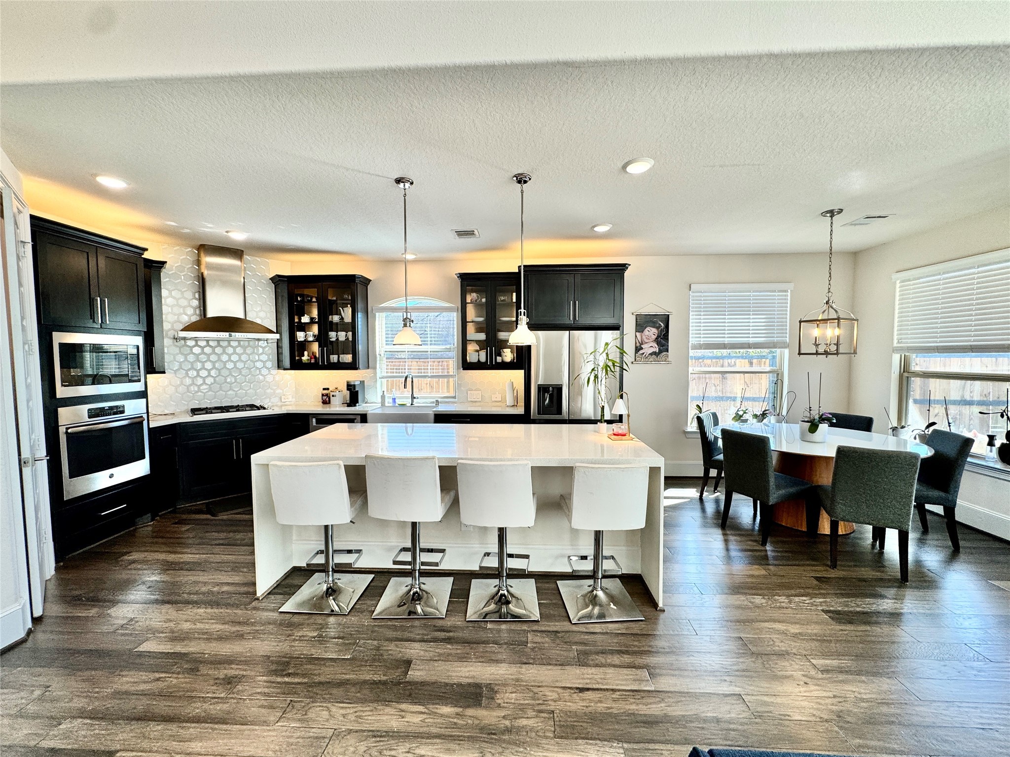 16803 Bark Cabin Drive Humble, TX 77346 - Photo 6 of 27 a large kitchen with a table and chairs