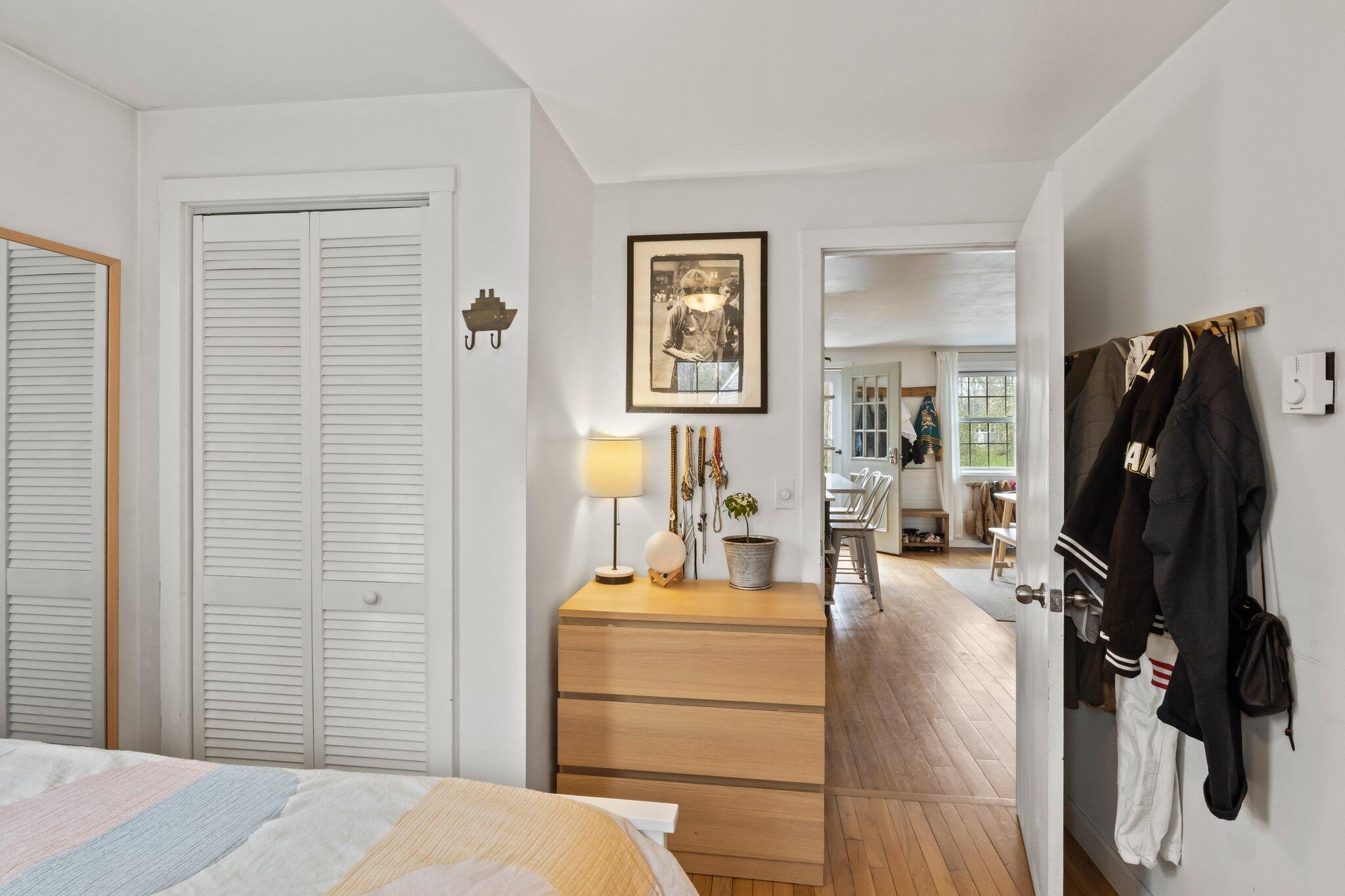 582 Massasoit Road Eastham, MA 02642 - Photo 18 of 45 a bedroom with a bed and furniture