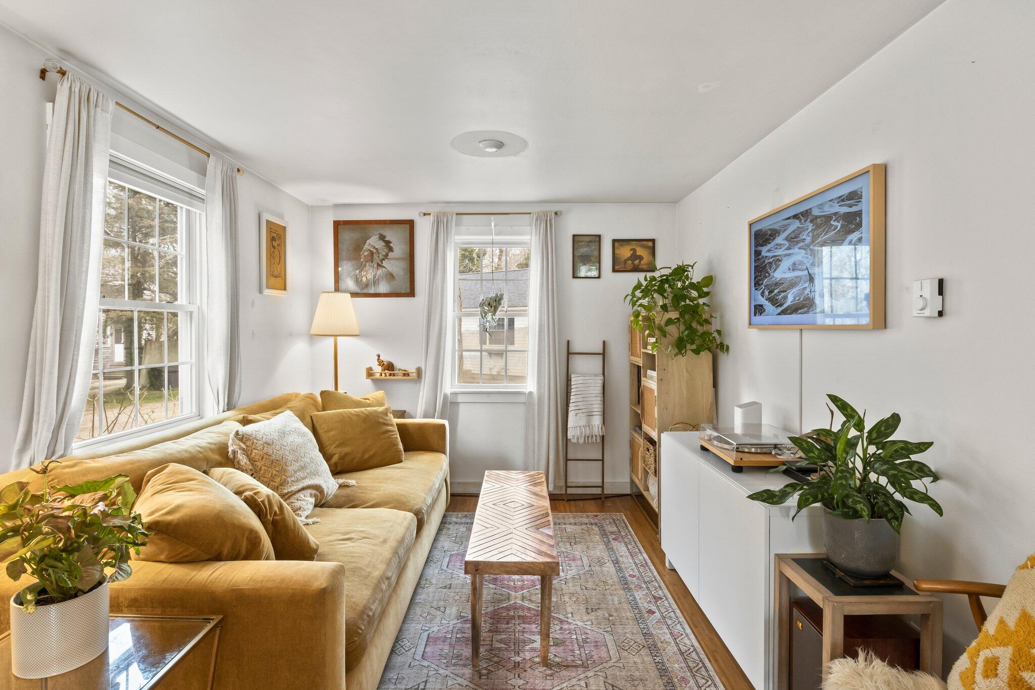 582 Massasoit Road Eastham, MA 02642 - Photo 20 of 45 a living room with furniture and a potted plant
