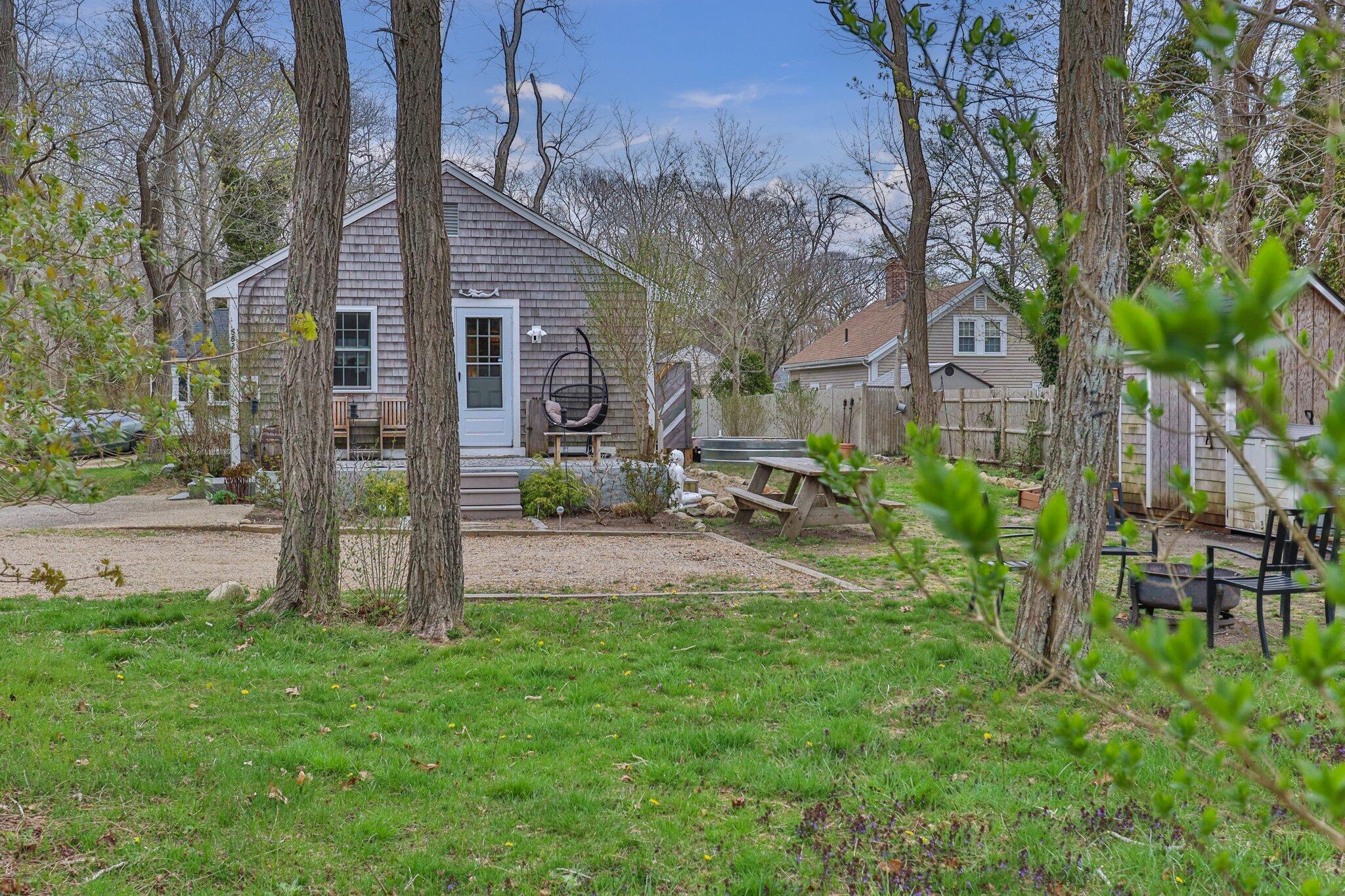 582 Massasoit Road Eastham, MA 02642 - Photo 2 of 45 a view of backyard of house with green space