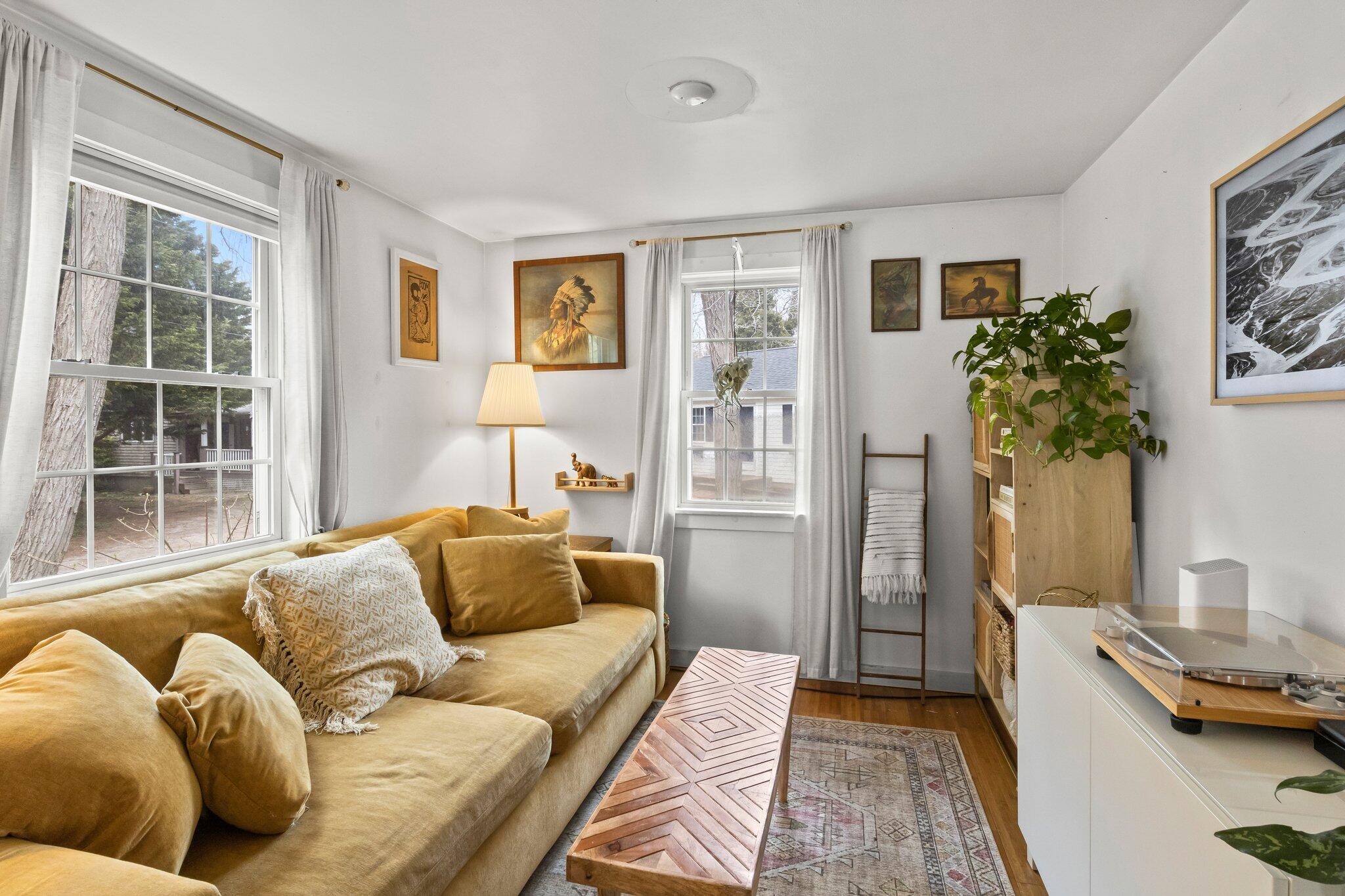582 Massasoit Road Eastham, MA 02642 - Photo 22 of 45 a living room with furniture and a couch