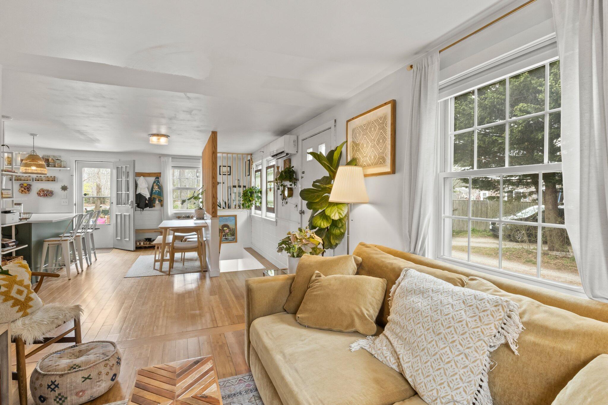 582 Massasoit Road Eastham, MA 02642 - Photo 23 of 45 a living room with furniture and a large window