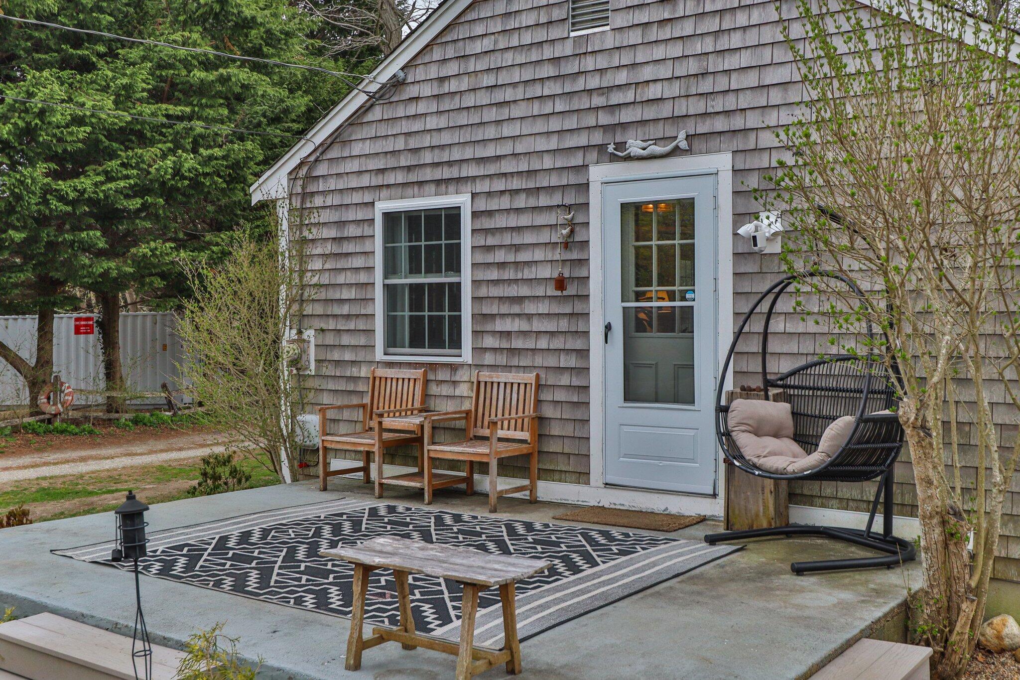 582 Massasoit Road Eastham, MA 02642 - Photo 27 of 45 a view of a house with backyard and sitting area