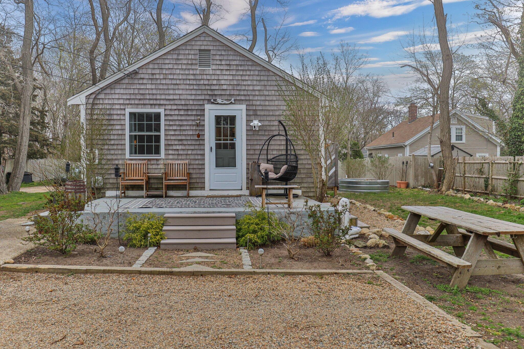 582 Massasoit Road Eastham, MA 02642 - Photo 28 of 45 a front view of a house with a yard