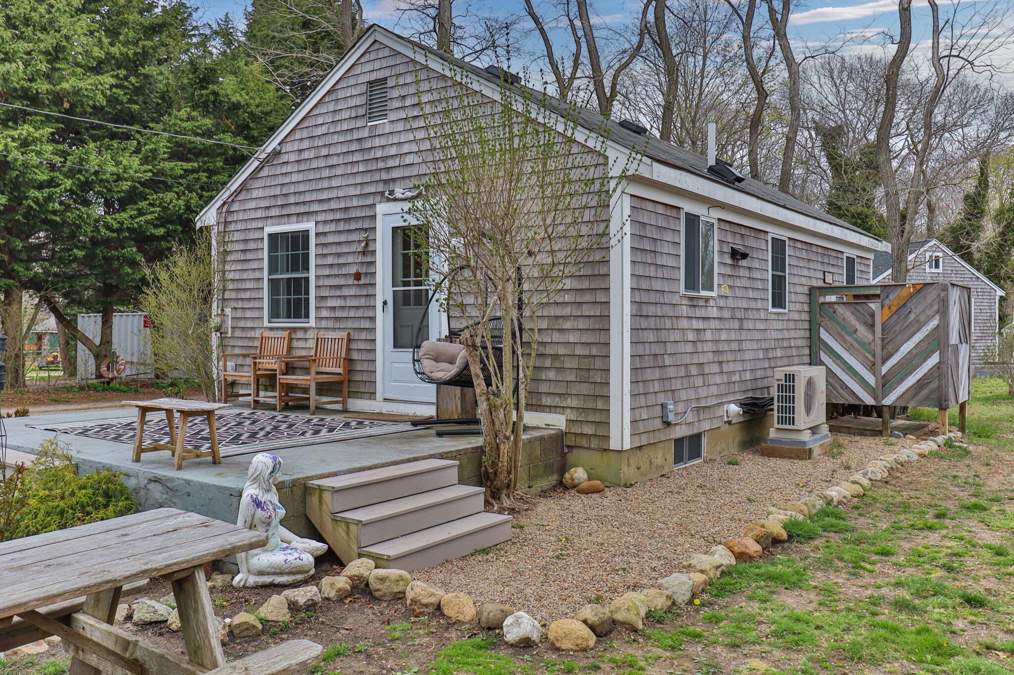 582 Massasoit Road Eastham, MA 02642 - Photo 30 of 45 a front view of a house with garden