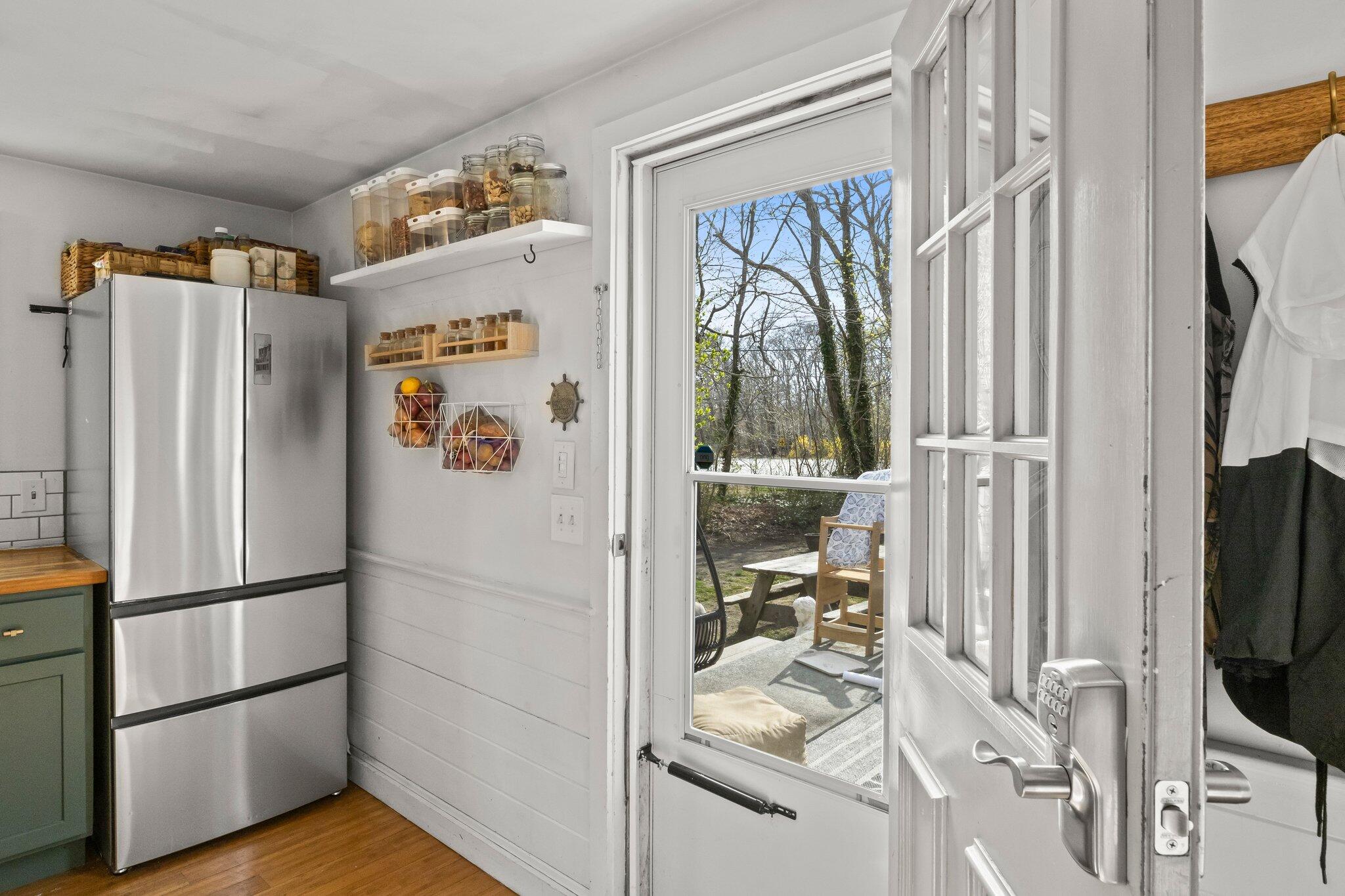 582 Massasoit Road Eastham, MA 02642 - Photo 3 of 45 a kitchen with stainless steel appliances granite countertop a refrigerator and a stove top oven