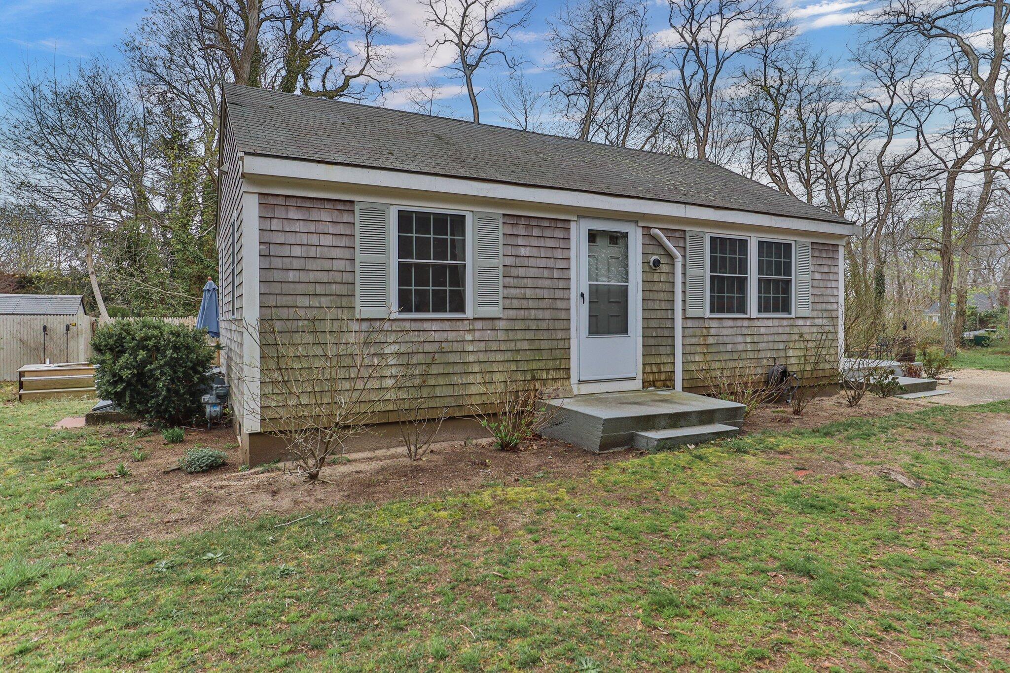 582 Massasoit Road Eastham, MA 02642 - Photo 38 of 45 a front view of a house with a yard